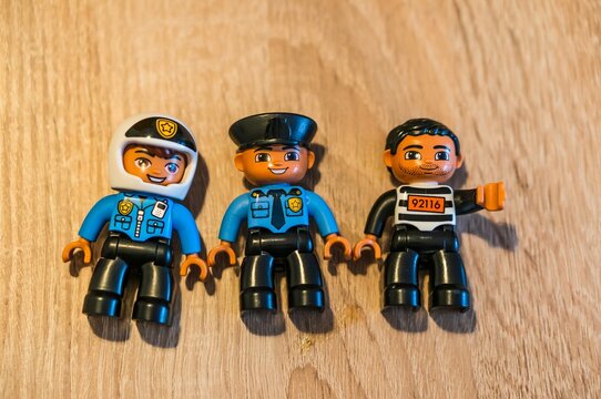 Three Lego Duplo figurines.