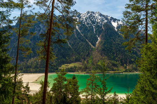During a spring hiking exercise it is always worth to spot though the green forest nature towards to the Achensee lake and the beautiful turquoise colored water