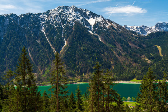 During a spring hiking exercise it is always worth to spot though the green forest nature towards to the Achensee lake and the beautiful turquoise colored water