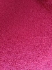 Fototapeta premium Dark red or maroon fabric background 