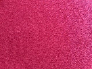 Fototapeta premium Dark red or maroon fabric background 