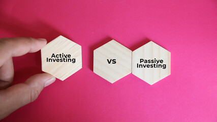 wooden block with the words Active Investing vs Passive Investing. two different approaches to managing an investment portfolio, each with its own strategy, benefits.