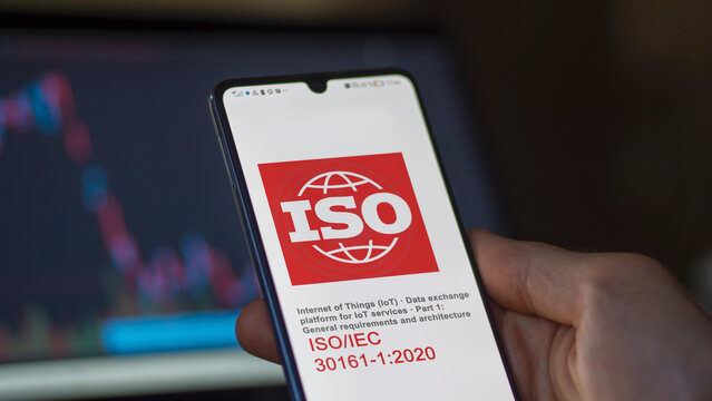 Engineer reading ISO IEC guide lines for iso 3061 1 2020