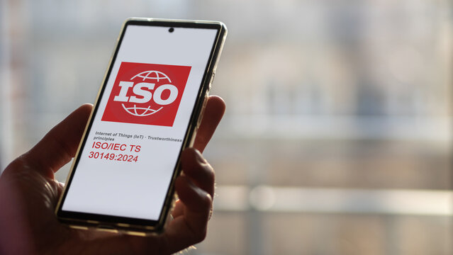 Engineer reading ISO IEC guide lines for 30149 2024