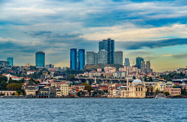 Naklejka premium view from a pleasure boat on the Bosphorus and the cityscape of Istanbul, Turkey, the modern architecture of the city, a popular tourist destination.