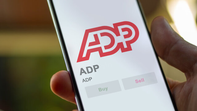 ADP on the screen of an exchange. ADP price stocks, $ADP on a device, Roseland, New Jersey. close up on logo.