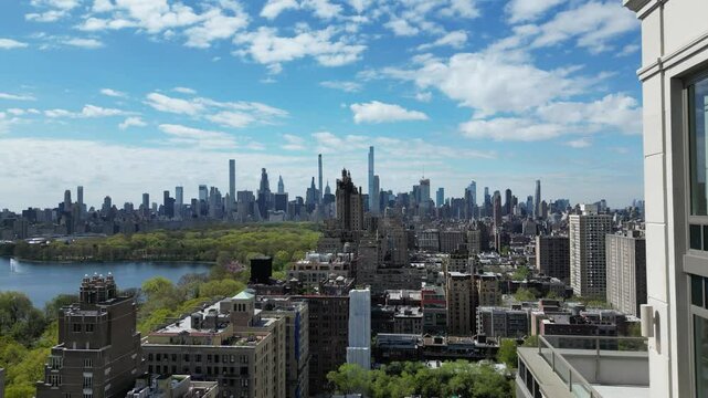 A drone push-in shot of West 96th Street, New York, showcasing the city's vibrant streets and buildings in horizontal orientation. Perfect for urban landscape and city reveal footage.