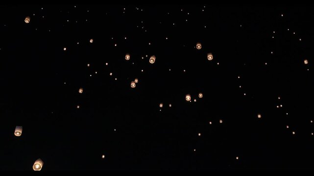 Asian fire lanterns launching during festival yee peng festival. Loy Krathong celebration, Chiang Mai, Thailand