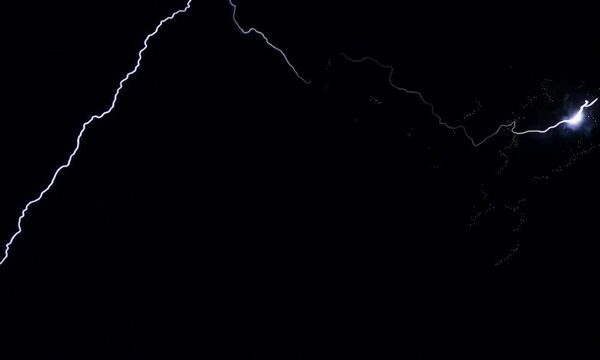 A striking image of white lightning bolts against a black background.