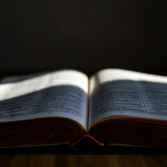 An antique bible opened up on a desk sun shines old testament reading ancient book old textbook