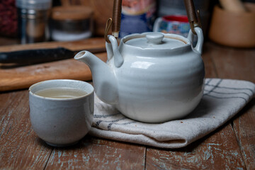 teacup and teapot on table