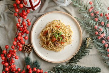 Festive pasta dish surrounded by Christmas decorations, capturing holiday vibes with lights, ornaments, and a cozy festive setting. Perfect for themes like Christmas food, holiday celebrations.
