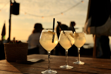 Cocktails (Limoncello Spritz) on the beach at sunset. 