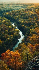 Obraz premium A breathtaking view of the winding river through the vibrant autumn foliage in Hoosier National Forest during sunset