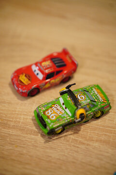Vertical shot of Mattel Disney Pixar Chick Hicks and Lightning McQueen toy model race cars
