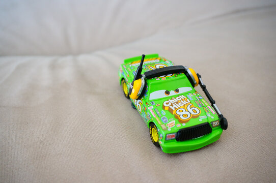 Green toy Chick Hicks car with headphones
