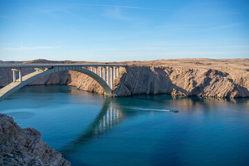 Fototapeta premium Croatia, Paski bridge. Road reinforced concrete arch bridge connecting the island of Pag with the mainland of Croatia