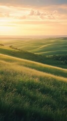 Obraz premium A stunning sunset over the rolling hills of the Flint Hills, showcasing vibrant green grass and the vastness of the landscape