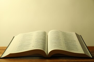Fototapeta premium Open Holy Bible in English language on wooden table