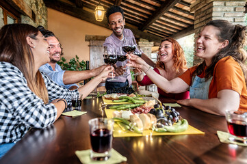 Young people having dinner party sitting in bar restaurant porch - Happy friends having fun...