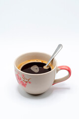 A glass of hot black coffee for your morning drink.