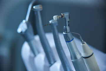 Dental tools arranged for a procedure in a modern clinic setting during daylight hours