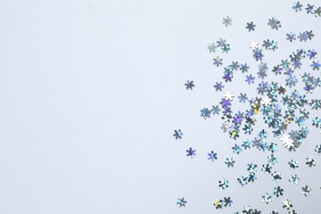 Beautiful silver confetti on a white background