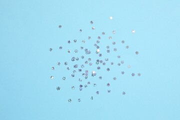 Beautiful silver confetti on a color background
