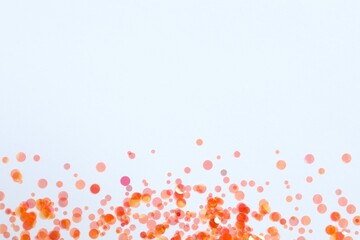 Fototapeta premium Beautiful orange confetti on a white background