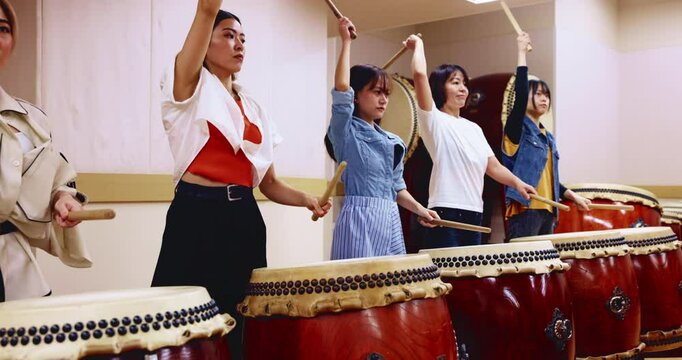 Performance, taiko and group with instrument, art and energy for practice, playing or traditional. Talent, drummer and Japanese people with drums for culture, skills or music for spiritual expression