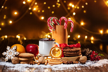 Close-up of traditional Christmas mulled wine with spices and cookies on Christmas market