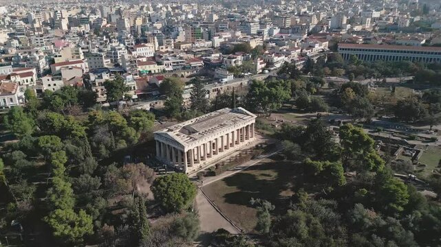 Ancient temple of Hephaestus in historical centre of Athens, Agora aerial panoramic footage