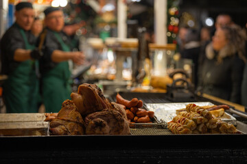 Budapest, Hungary - November 15, 2024: Grilled Skewers and Sausages Cooking. Vorosmarty square Christmas market.