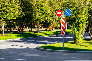 road sign indicating a detour around a dead end. obstacle avoidance. road sign prohibiting passage....