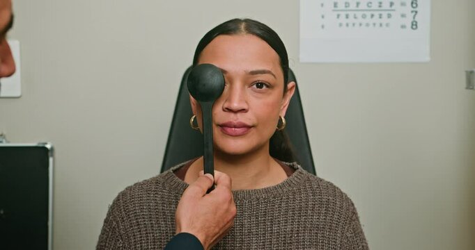 Young Woman Having Her Eyesight Tested by an Optometrist in a Medical Clinic