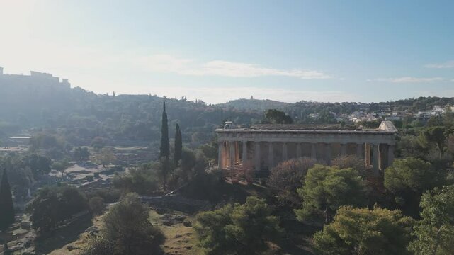 Ancient temple of Hephaestus in historical centre of Athens, Agora aerial panoramic footage