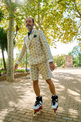 Man rollerblading under trees in a park on a sunny day