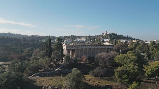Ancient temple of Hephaestus in historical centre of Athens, Agora aerial panoramic footage