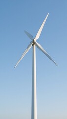 Modern wind turbine towering over clear skies representing clean energy and environmental conservation
