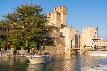 Sirmione, Italy - November 6, 2024: Scaliger Castle, the historic center of Sirmione, on the shores...