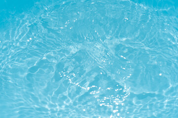 Blue water with ripples on the surface. Defocus blurred transparent blue colored clear calm water...