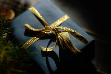 Luxury Christmas gift box decorated golden ribbon.