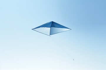 A minimalist design of a kite with a sleek, modern look in shades of blue and white, perfectly silhouetted against a clear sky 