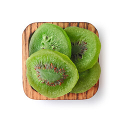 Dried kiwi fruit in square wooden bowl isolated on white background top view. Healthy snack, vegetarian sweets.    