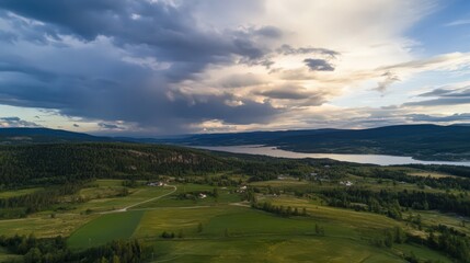 Obraz premium A cloudy sky with a mountain in the background
