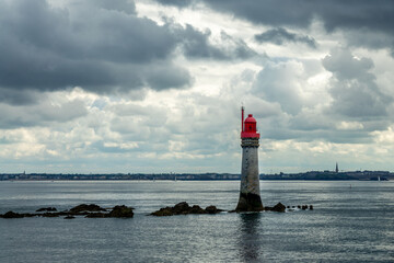 The Grand Jardin lighthouse, dark clouds in Saint Malo, Ille-et-Vilaine, Brittany, France