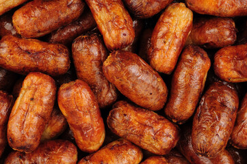 Cooked small pork meat cocktail buffet sausages background