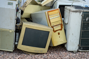 Old computer set be mix up with pile of electrical appliances waste