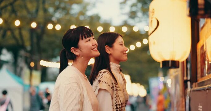 Festival, map and Japanese people at market for culture celebration, tourism event and spring season. Street vendor, hanami holiday and traditional with Asian friends and notice board for location