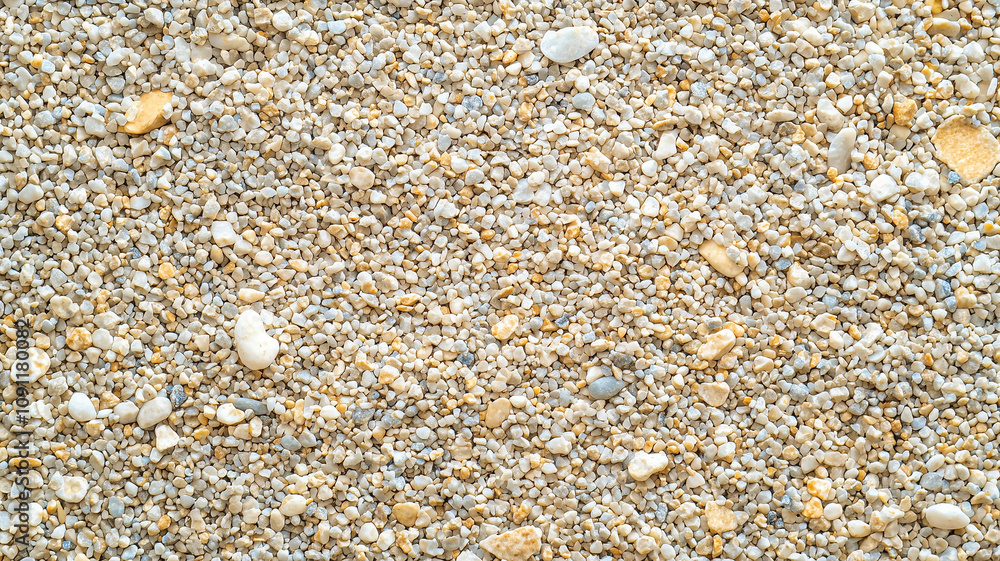 Aufkleber top view of gravel texture with small, rounded stones in various shades of beige and white, creating